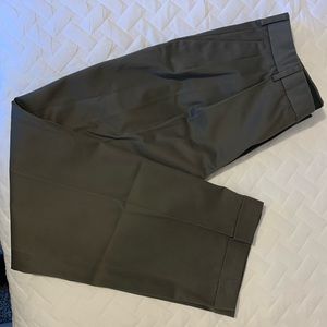 Dockers khaki pants, front pleats. Button and zipper closure